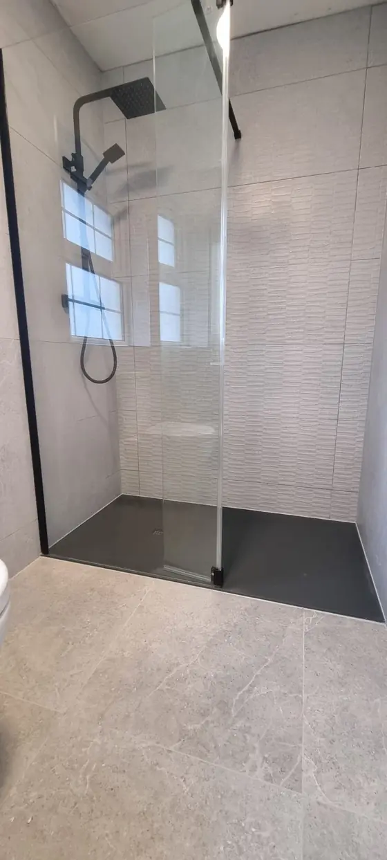 Walk-in shower with rainfall head and black fittings, Cork bathroom renovation