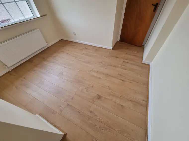 Wood floor installation with neat finish at skirting and door, Bandon