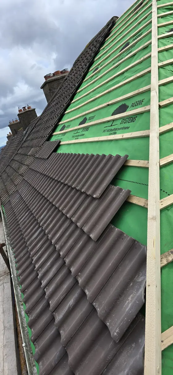 Roof battens and breathable membrane installed before re-tiling, Cork