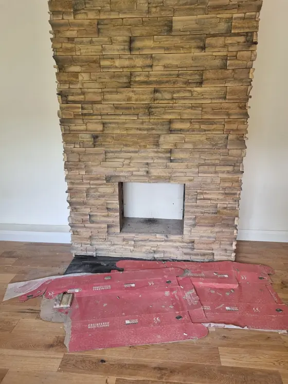Stone-clad chimney breast and fireplace installation, Bandon
