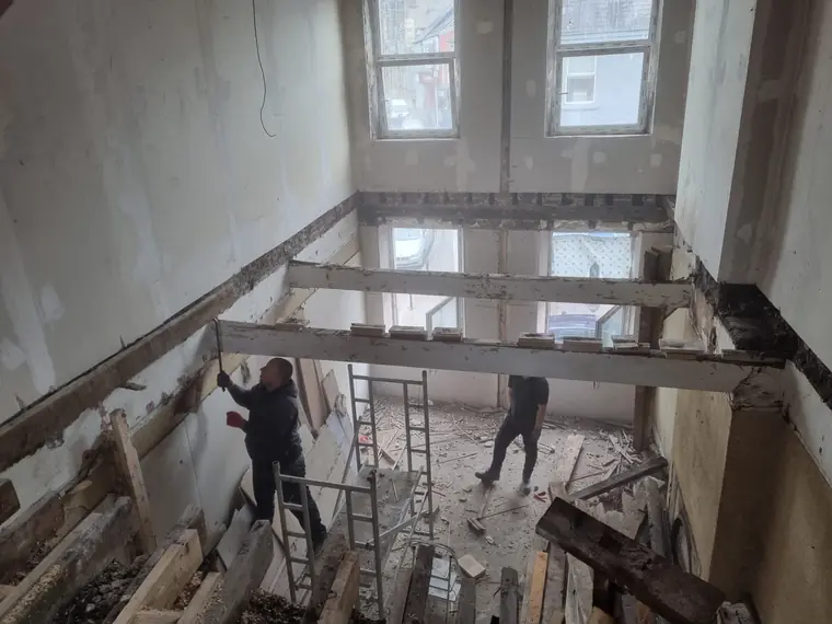 Structural timber works in a double-height room during renovation, Cork